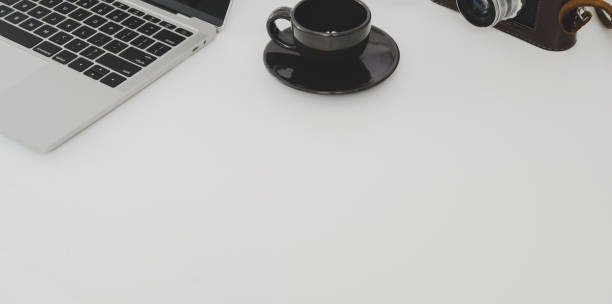 istock Top view of minimal workplace with laptop computer and coffee cup with copy space 1177574801