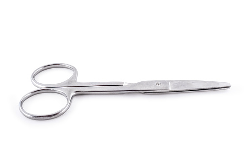 Metal scissors. Paper cutting tool. Sharp scissors on white background.