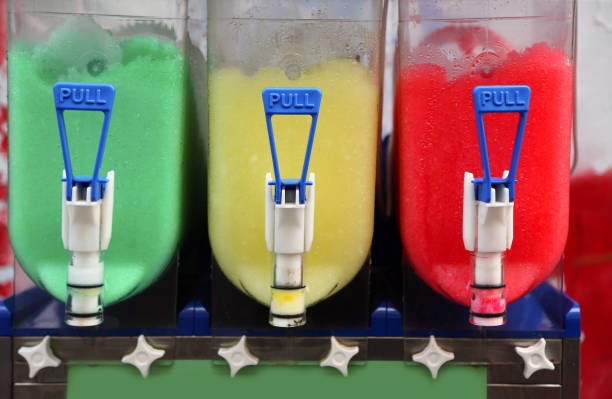 istock dispenser of Shave ice with colored syrup 1177580310