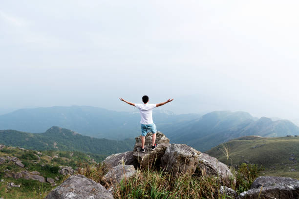 istock Man on the top of mountain 1177586776
