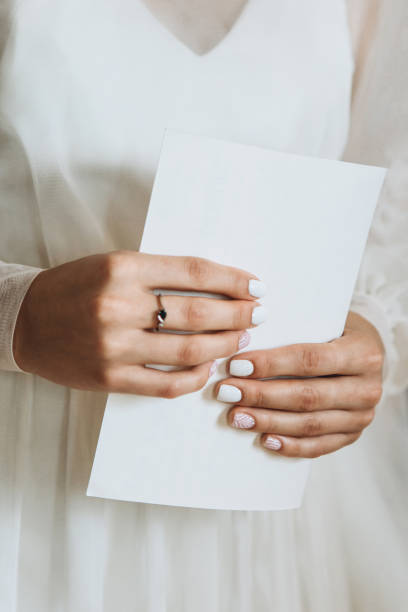 istock The bride holds an oath in her hands 1177589598