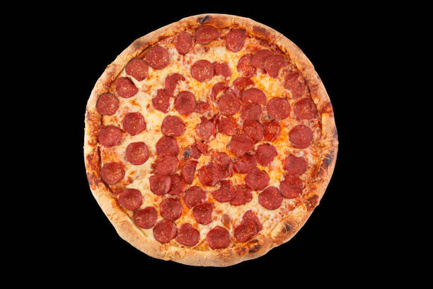 istock Pepperoni pizza arrangement isolated on black background. Close-up. 1177590211