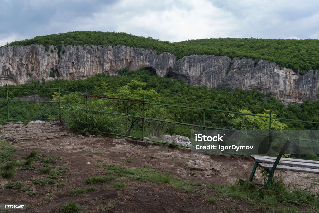 Viewpoint "The bench of Love" on edge of canyon Dryanovo river near
Monastery St. Archangel Michael, Gabrovo region, Bulgaria Architectural Dome Stock Photo