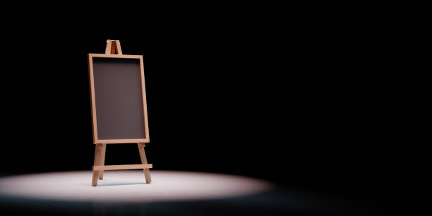 Blank Blackboard Spotlighted on Black Background Blank Blackboard on Wooden Easel Spotlighted on Black Background with Copy Space 3D Illustration lavagna stock pictures, royalty-free photos & images