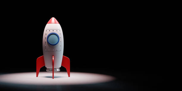 istock Cartoon Spaceship Spotlighted on Black Background 1177592799