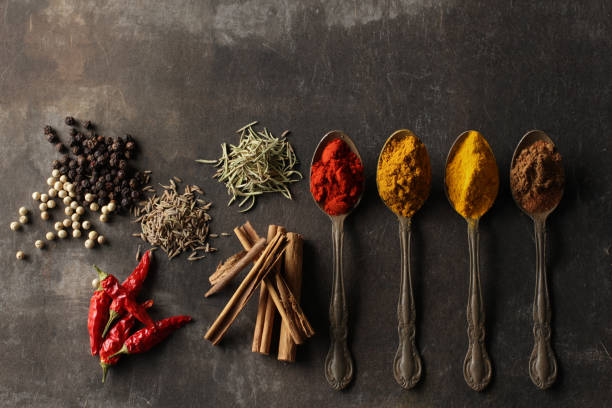 istock Spices placed on a plate with a black background, placed on a spoon, or left as is 1177597292