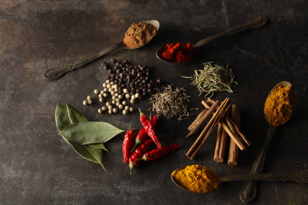 istock Spices placed on a plate with a black background, placed on a spoon, or left as is 1177597310