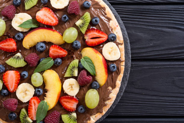 istock Fruit pizza with nut nougat cream , fruit and berries 1177619091