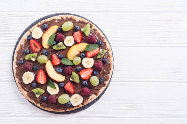 istock Fruit pizza with nut nougat cream , fruit and berries 1177619093