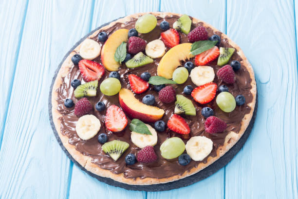 istock Fruit pizza with nut nougat cream , fruit and berries 1177619106