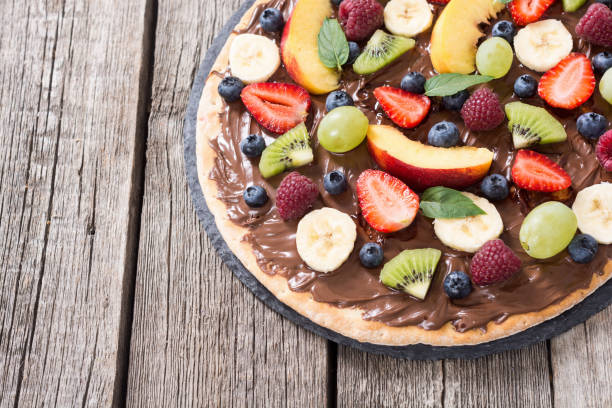istock Fruit pizza with nut nougat cream , fruit and berries 1177619645