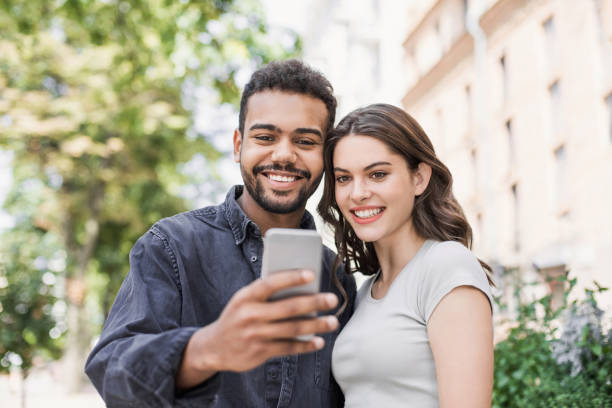 istock Beautiful happy couple using smartphone 1177619677