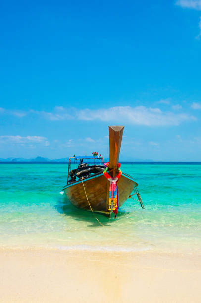 istock longtail boat in a blue lagoon in Thailand 1177620308