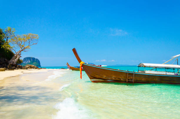 istock longtail boat in a blue lagoon in Thailand 1177620808