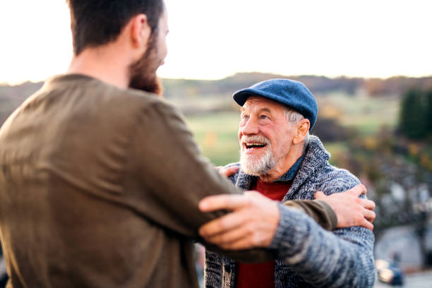istock Senior father and his son on walk in nature, talking. 1177626788