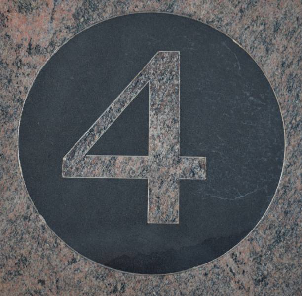 istock Number 4 four in pink marble inside a circle of black marble 1177628115
