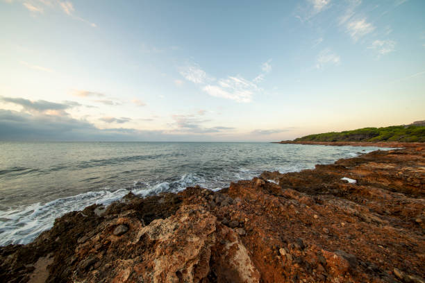 istock Sunrise between rocks and the Oropesa Sea 1177628437