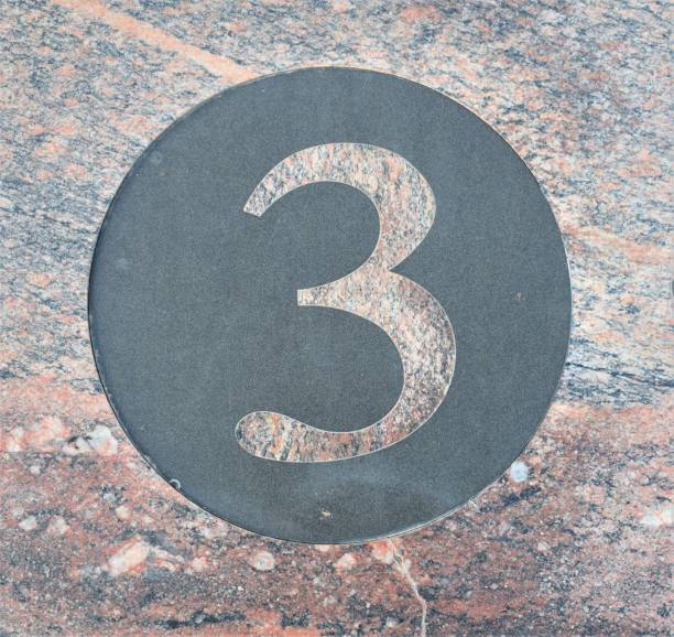 istock Number three in pink marble inside a circle of black marble 1177629096