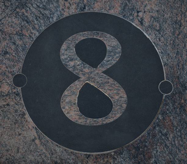 istock 8, Pink marble number inside a circle of black marble 1177629379