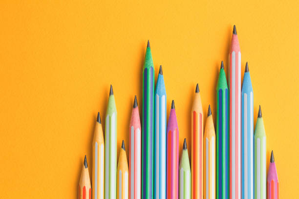 istock multicolored pencils on a yellow isolated background 1177629440