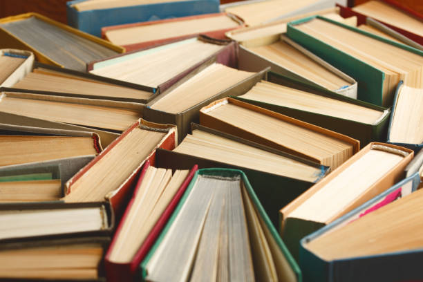 istock Old hardback books background. education background. 1177629625