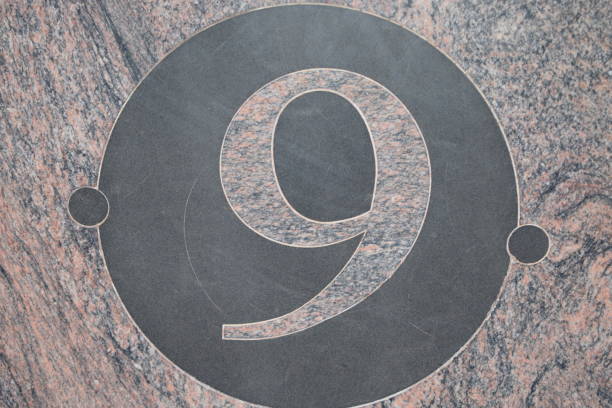 istock 9 inside a circle of black marble, pink marble 1177630385