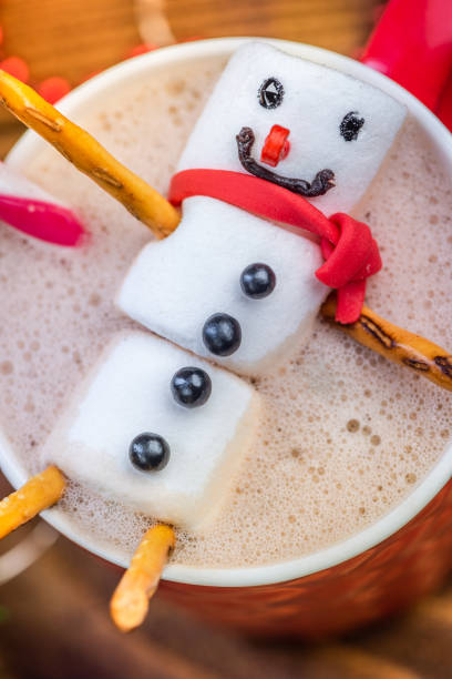 istock Marshmallow Snowman Melting in Hot Chocolate in Red Festive Cup 1177630634