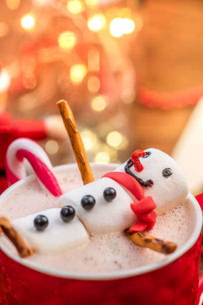 istock Funny Smiling Snowman Relaxing in Hot Chocolate Cup 1177630822