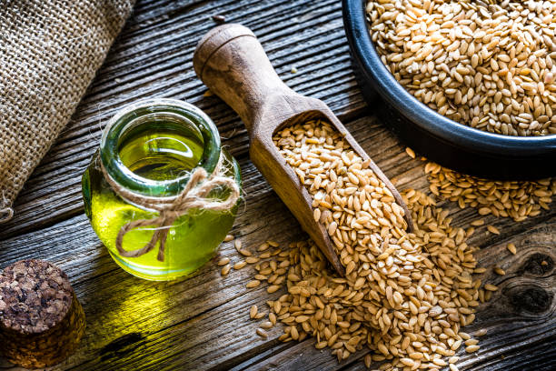 Healthy eating: Ffax seed oil and flax seeds stock photo