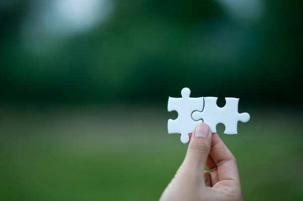 istock Hands and puzzles, important pieces of teamwork Teamwork concept 1177633545