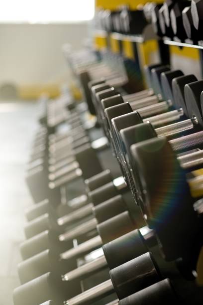 istock dumbbells of different weights in the gym 1177633724