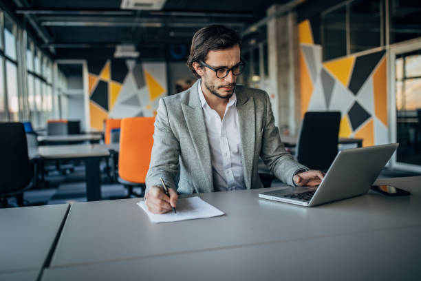 istock Young businessman working alone in office 1177634512