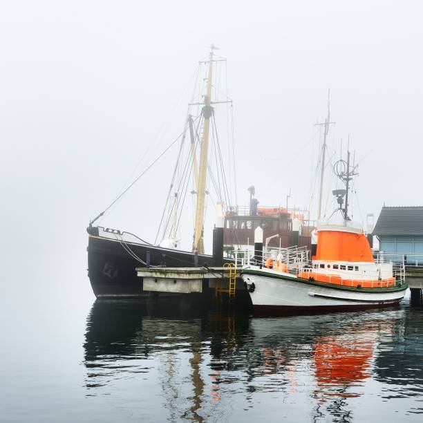 istock A pier with small boats under fog 1177640409