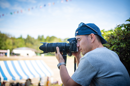 Men taking photo at athletic meet