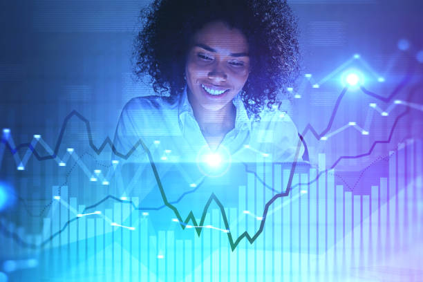 istock Smiling African woman working with digital graphs 1177648077