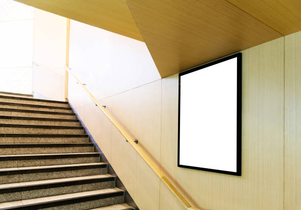 Blank billboard on the wall of underground passage