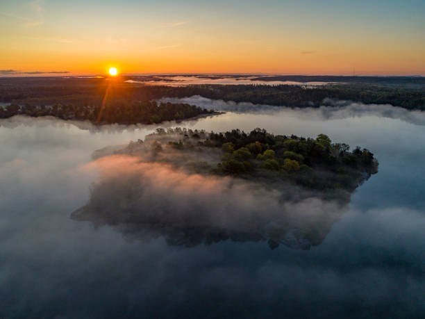 istock Aerial view over foggy lake 1177653019