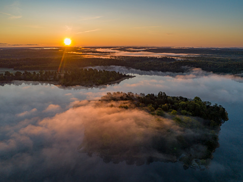 Aerial view over foggy lake in Sweden