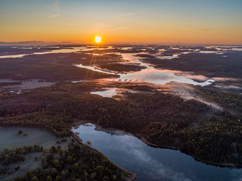 Aerial view over foggy lake in Sweden