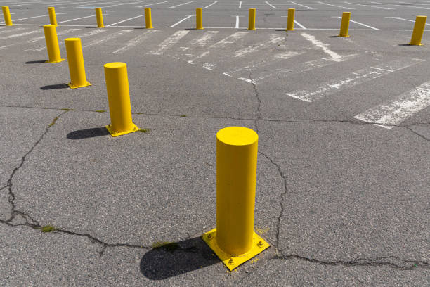 istock Crosswalk on gray asphalt road surrounded by yellow direction signs 1177654923