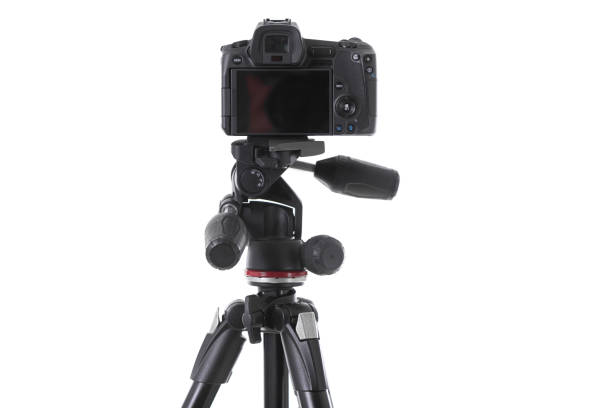 istock Backside view of modern multifunctional black camera on trepied isolated 1177656335