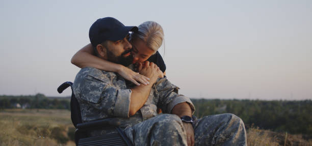 istock Wife hugging wheelchaired husband 1177656537