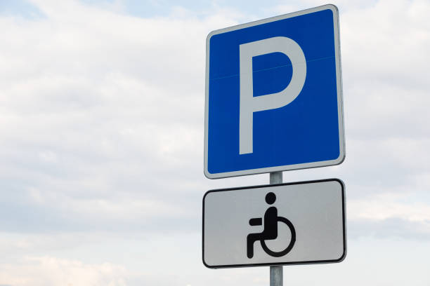 istock Roadsign Parking lot with white tablet for handicapped 1177656977