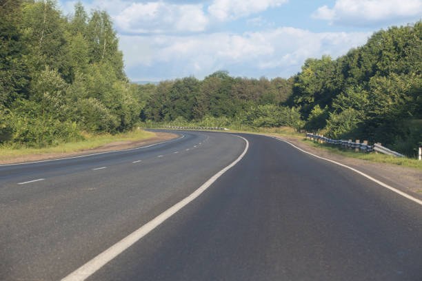 istock countryside highway in a forest area 1177661019