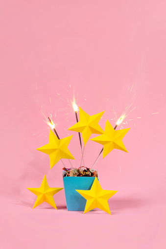 Exploding gift box with 5 stars and sparkler firework