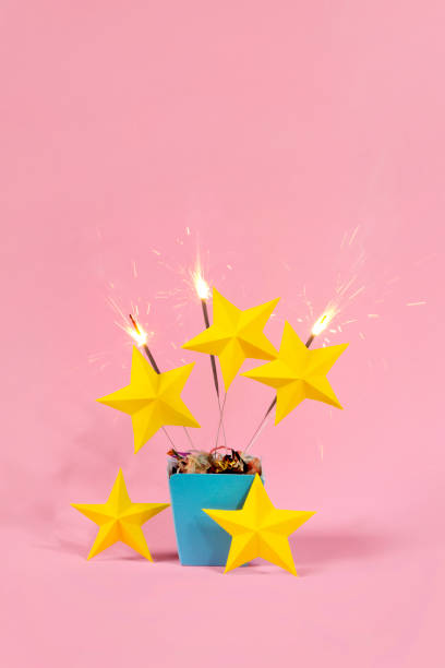 Exploding gift box with 5 stars and sparkler firework Exploding gift box with 5 stars and sparkler firework first class photos stock pictures, royalty-free photos & images