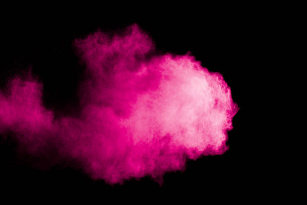 istock pink particles explosion on black background. Colorful dust splatter on black background. 1177670659