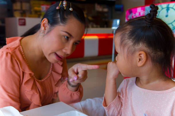 istock Angry mom with her child,  looking her daughter and complaining. 1177680723