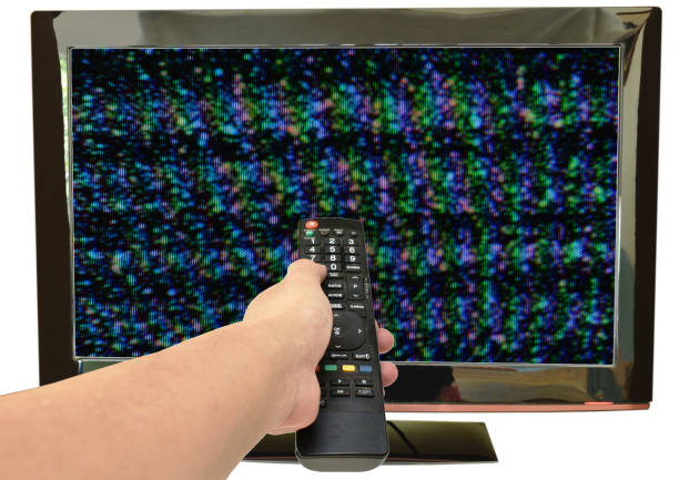 istock hand press television remote control for searching signal glitch on television screen 1177683250