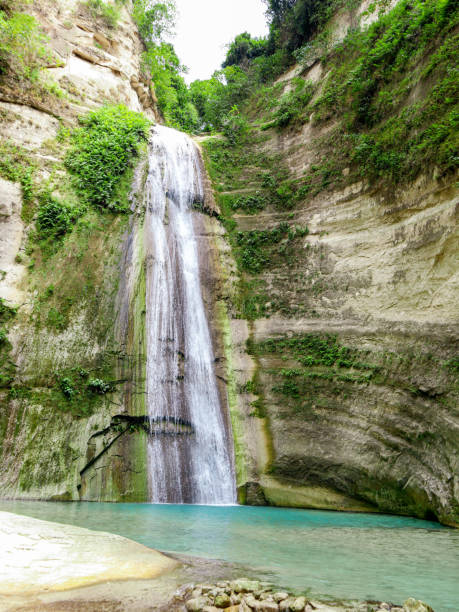 istock Tropical waterfall at mountain gorge in Dao Falls in Cebu Island 1177684480